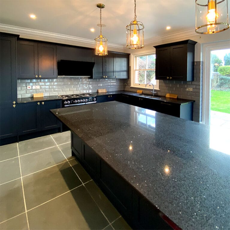 Navy shaker kitchen with quartz island