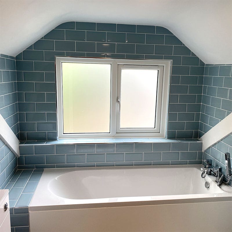 Blue metro tile family bathroom